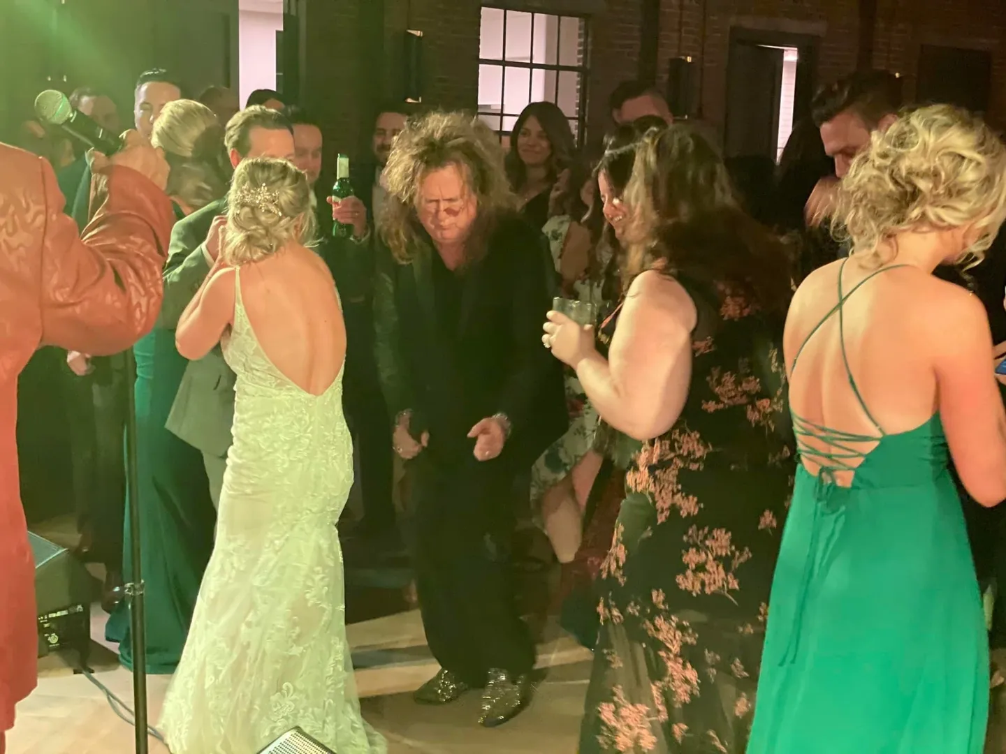 Bunch of people dancing at a wedding