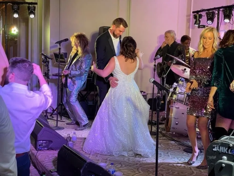 Bride and groom dancing on the stage